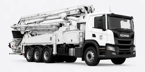 Concrete pump truck placing concrete on a building site